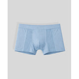 Light blue boxer briefs on a light gray background