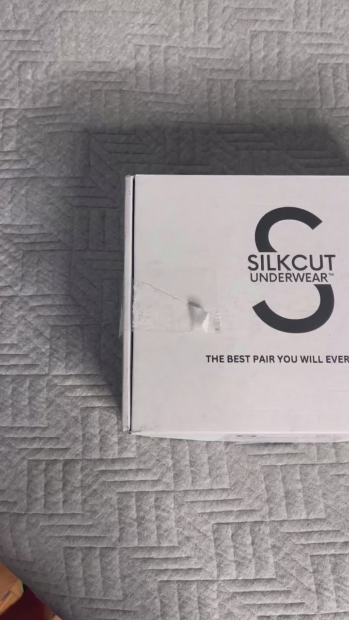SilkCut Underwear packaging box with Modal Stretch Trunk branding on neutral fabric surface