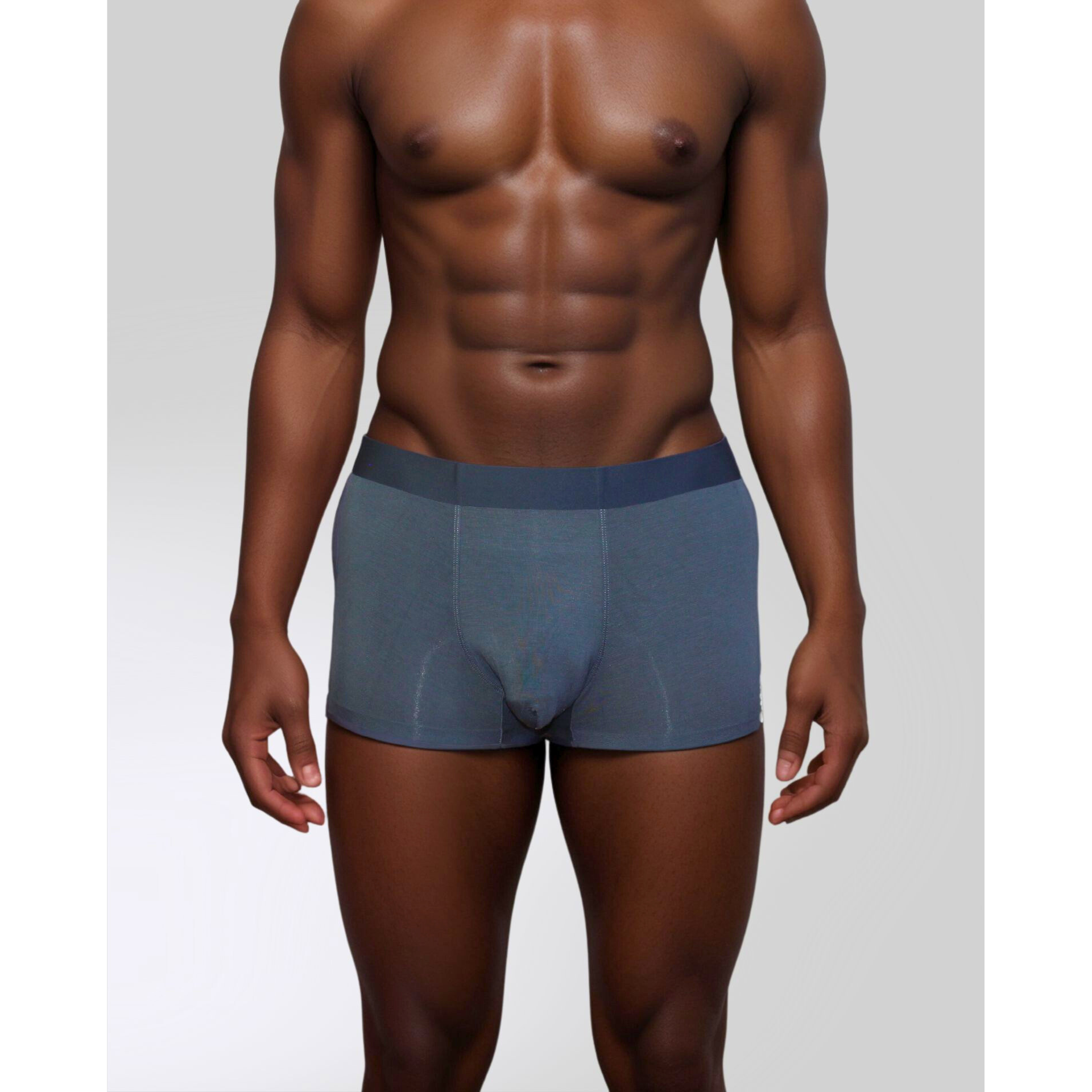 Male model in blue SilkCut Modal Stretch Trunk showing seamless side design and flexible waistband